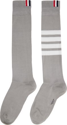 Pair of lightweight knee-high cotton-blend jersey socks in gray. · Signature tricolor patch at rib-knit collar · Intarsia signature stripes at calf · Logo printed at sole Supplier color: Lt grey Over The Calf Socks, Calf Socks, Knit Collar, Thom Browne, Tri Color, Knee High, Rib Knit, Cotton Blend, Stripes