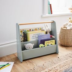 a child's bookshelf with stuffed animals in it