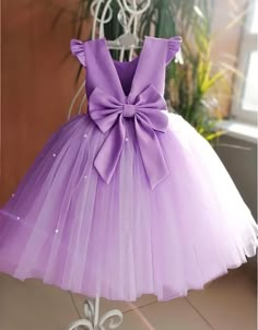 Sequins add a dazzling touch to the bodice of this children's party or Flower Girl dress, which features a fluttering tulle skirt with a handkerchief hem and a large ribbon bow at the back. Lined 95% polyester, 5% spandex contrast Hand wash, dry flat Party Dress For Kids, Cheap Playful Princess Dress For Party, Birthday Dresses For Kids, Kids Party Dress, Birthday Outfit For Kids Girl, Birthday Frocks For Kids, Kids Birthday Dress For Girl, Dresses For Girls Kids, Skirt And Blouse For Kids