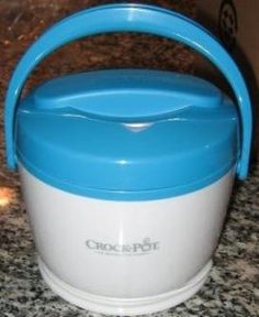 a blue and white crock pot sitting on top of a counter