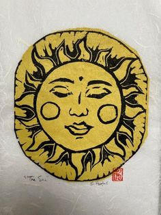 a drawing of the sun with eyes drawn on it