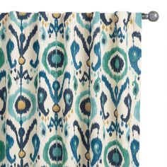 a curtain with blue and green designs on it