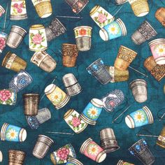 a blue background with coffee cups and pins