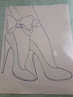 a drawing of a high heeled shoe with a bow