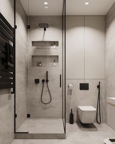 a bathroom with a shower, toilet and sink in it's center wall is lit by recessed lights