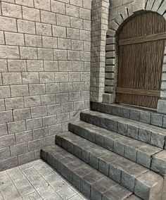 a set of stone steps leading up to a wooden door