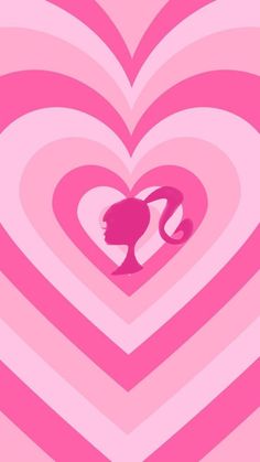 a pink heart with a woman's head in the center