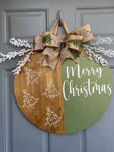 a wooden christmas ornament hanging on a door