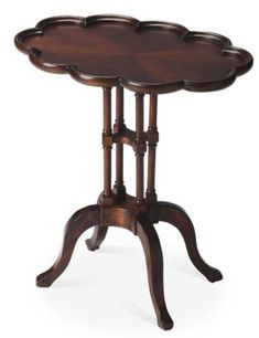 a small wooden table with three trays on it's legs and an oval top