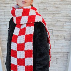 "Checkered Oversized Scarf This red checked scarf; Made with chunky 100% hypoallergenic micro-polyester yarn, vegan friendly. The thick scarf is incredibly soft, fluffy and so nice to touch. You'll look stylish while this checkered long scarf keeping you warm. This double sided checkered scarf is a perfect gift for her. Measuring approximately 82,6\" x 8,6\" / 210 x 22 cm  Please note the sizes may differ very slightly due to the handmade nature of the item.  Photos with flat backgrounds are more accurate for color tone. * Machine washable at 30 degrees * Dry flat * Dry cleanable * Do not iron Your hand knitted soft thick scarf will be carefully packed. We use natural lighting on our photos to get the most accurate colors, so please note that the colors may vary in different screens. Thank Red Knitted Scarf For Winter, Red Hand Knitted Scarves One Size, Red Hand Knitted Scarf One Size, Red Knitted Fall Scarves, Red Knitted Fall Scarf, Red Knitted Scarf For Fall, Red Plaid Scarf, Thick Scarf, Checkered Scarf