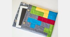 an ipad case made out of patchwork fabric