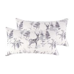 two pillows with deers and trees printed on the front, one is white and the other is black