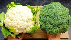 there are two pieces of broccoli on the cutting board