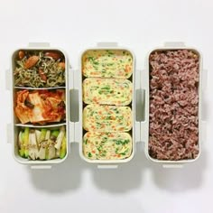 three plastic containers filled with food on top of a white table next to each other