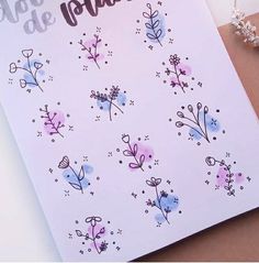 a close up of a card with flowers on it and the words happy valentine written in spanish