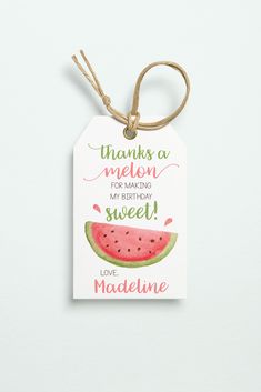 a watermelon tag hanging from a string