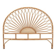 a bed frame made out of bamboo with a sun design on the headboard and foot board