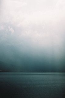 a boat floating on top of a large body of water