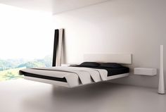 a modern bedroom with white walls and flooring is pictured in this image, there is a bed that has black sheets on it