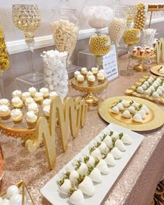 a table topped with lots of desserts and sweets