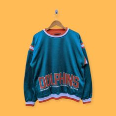 Vintage 90s Miami dolphins sweatshirt Miami dolphins crewneck Miami dolphins sweater pullover streetwear style nice green colour size medium by YoungmodernCo on Etsy Miami Dolphins Sweatshirt, Miami Dolphins, Vintage Wear, Shoulder Sleeve, Dolphins, Green Colors, Streetwear Fashion, Like New, Im Not Perfect