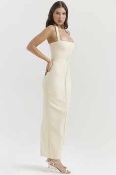 Our 'Mia' maxi dress is cut for a figure hugging fit that beautifully showcases the female form. Cut from an ecru crepe and woven with stretch for extra comfort, it has decorative detailing through the front and a corseted bodice to cinch the waist and lift your bust.The flattering halter neck reveals an open back and the generous split ensures easy movement. Size Small - Fits a 6-8 Aus Classy Summer Dress, Hot Jumpsuits, Fitted Maxi Dress, Maxi Dress Sale, Swimsuits Hot, Halter Maxi, Halter Maxi Dresses, Maxi Dress Party, Hot Dress