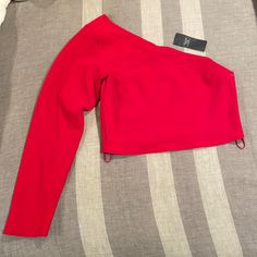 Brand New , Never Worn With Tags Still On. One Shoulder Long Sleeve Shirt. Trendy Red Tops For Winter, Red Winter Blouse For Party, Fitted Trendy Red Blouse, Trendy Fitted Red Tops, Red Fitted Crop Top For Fall, Fitted Red Crop Top For Fall, Chic Red Fitted Top, Red Stretch Tops For Spring, Stretch Red Top For Spring