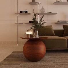 a living room with a couch, coffee table and shelves