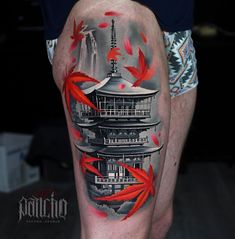 a man's leg with red fish and pagoda tattoo on his thigh, in front of a black background