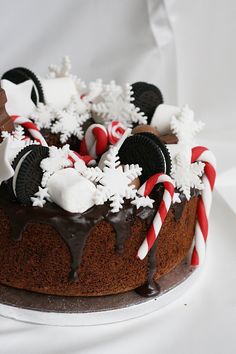 a cake with chocolate frosting and candy canes