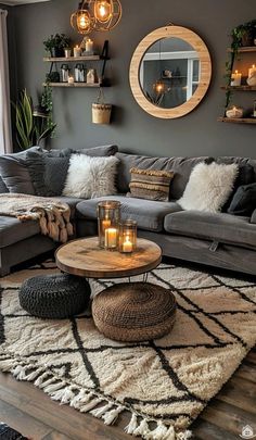 a living room filled with lots of furniture and candles on top of a rug in front of a window