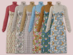 six dresses are lined up in different colors and sizes, all with flowers on them