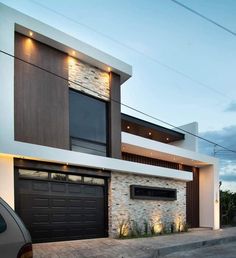 a car parked in front of a modern house