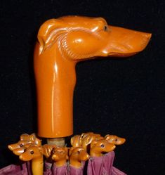 an orange plastic dog head sticking out of a purple bag