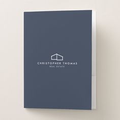 a blue book with the words christpher thomas real estate on it