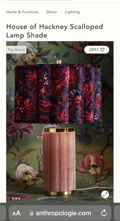 a pink table lamp with red and blue shades on the lampshade is featured in an article by anthropologie com