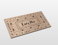 a wooden game board with the words last dice written in black and white on it