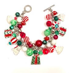 Beautiful Red, Green and White Christmas Charm Bracelet with a toggle clasp features one 7 Enamel pne sided charms total (3 Christmas Present charms, 2 Christmas trees, and 2 Santa Claus) with coordinating beads. Bracelet is approximately 7.5 inches long. I will be happy to resize the bracelet at no additional charge. 2 Christmas Trees, Green And White Christmas, Snowflake Bracelet, Beaded Projects, Pink Ornament, Fun Bracelet, Christmas Tree Earrings, Snowflake Earrings, Christmas Bracelet