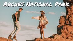 two people standing on rocks with the words arches national park in front of their faces