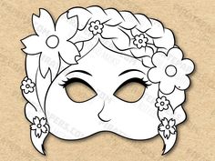 a paper mask with flowers on it