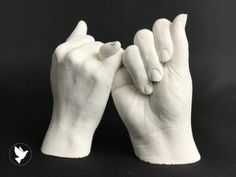 two white hands that are touching each other