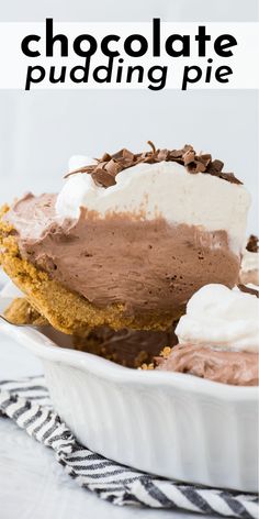 a chocolate pudding pie with whipped cream and chocolate chips on top in a white dish