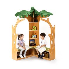 two children sitting in a wooden tree house with books on the shelves and one reading