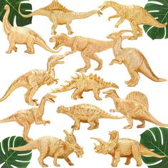 a bunch of toy dinosaurs with green leaves on the backgroung and white background