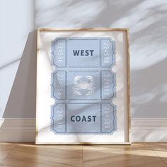 a framed poster with the words west and coast on it