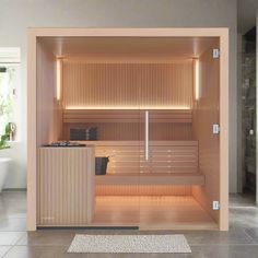 an empty sauna in the middle of a bathroom