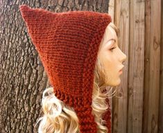 Knit Hat Style: Pixie Hat - a chunky knit bonnet with a pointed crown and knitted ties, for women, men and teens. Color: This sample hat is shown in Spice, a burnt orange. You can choose from 33 colors. Please see the last two photos in the listing and zoom in for a visual reference of your color choices, then select it from the drop down menu when ordering. Sizes: One size fits average teen or adult head size of 20" to 23" (50.5 cm to 58 cm). Fiber Content: 80% acrylic, 20% Wool Characteristics Fall Fashion Accessories, Yarn Ideas, Chunky Knit Hat, Orange Hats, Pixie Hat, Handmade Knitwear, Womens Hat, Warm Winter Hats, Hand Knit Hat