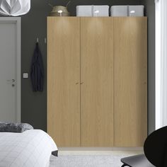 a bedroom scene with focus on the armoire and closets in the background,