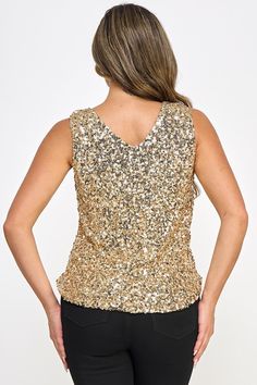 This luxurious gold sequin sleeveless top is perfect for showcasing your style during any special event. The sequins add a touch of sparkle and shine to your outfit that will have everyone looking your way. Perfect for the holidays, this top will elevate your look. Model measurements Model is wearing size Small Height: 5'9.5" Bust: 33 Waist: 25 Hip: 34 Fabric Contents 97% Polyester 3% Spandex Imported Size Chart XS = Dress 0-2, Bust, 31"-32.5", Waist 23"-24, Hip 31"- 34"Small = Dress 4-6, Bust,3 Gold Embellished Sleeveless Sequin Dress, Embellished V-neck Tank Top For Party, Sparkling Sleeveless Tops For Party Season, Chic Gold Sleeveless Sequin Dress, Sparkling Sleeveless Top For Night Out, Glamorous Sleeveless Sparkling Tops, Gold Sparkling Sleeveless Sequin Dress, Chic Gold Sequin Dress With Contrast Sequin, Glamorous Embellished Tops For Party Season