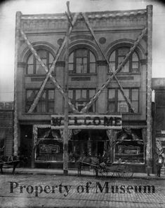 an old black and white photo of a building with the words property of museum on it